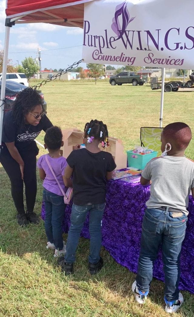 Chulyndria Laye with children at WINGS Fall Festival, Dumas, Arkansas.
