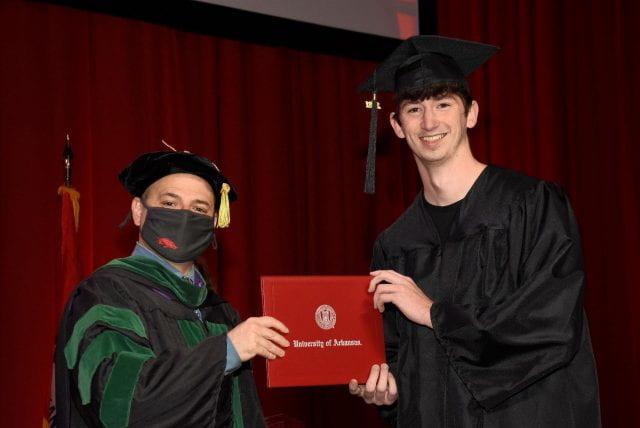 COEHP Exercise Science student Kobe Rose at graduation with Dean Brian Primack.