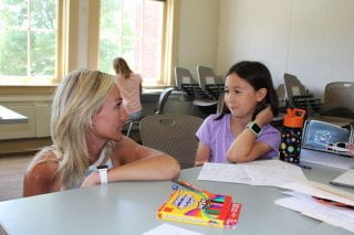 Teacher Rebecca Webb with Young Writers Camp student.