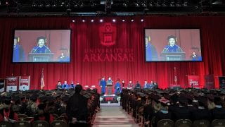 Speeches begin the fall 2022 commencement ceremonies Dec. 17 in Bud Walton Arena of the University of Arkansas.