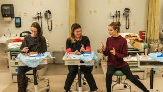 Eleanor Mann School of Nursing student simulate a medical procedure.