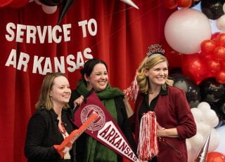 Members of the college's Office of Research and Grant Administration pose for a fun photo at the Service to Arkansas Celebration on Dec. 11, 2023.