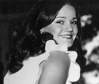 Black and White photo of a young Rebecca Thompson.