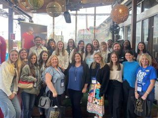 Teacher candidates and faculty members at a luncheon during their trip to the Arkansas Association for Middle Level Education conference in Little Rock.
